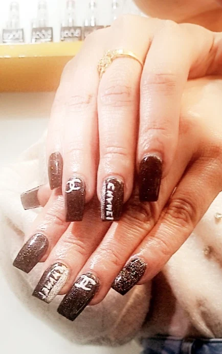 Detailed brown and gold nail art
